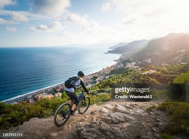 athlete riding bike on mountain - corsica france stock pictures, royalty-free photos & images