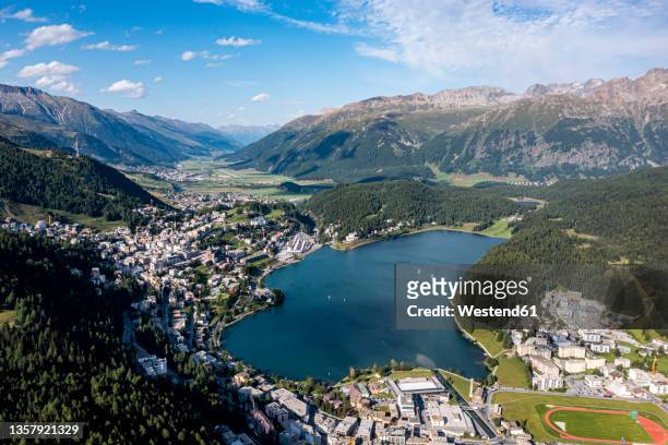 switzerland, canton of grisons, saint moritz, town in engadin valley with lake in center - st moritz stock pictures, royalty-free photos & images