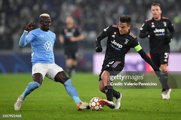 Paulo Dybala of Juventus tackles Innocent Bonke of Malmo FF during the UEFA Champions League group H match between Juventus and Malmo FF at the...