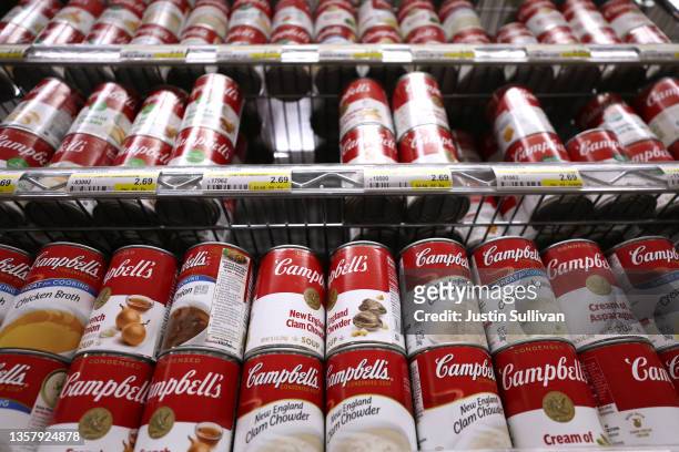 Cans of Campbell's Soup are displayed on a shelf at Scotty's Market on December 08, 2021 in San Rafael, California. Campbell Soup Company reported...