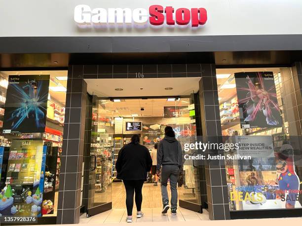 Customers enter a GameStop store on December 08, 2021 in San Rafael, California. Video game retailer GameStop will report third quarter earnings...