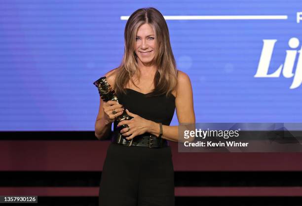Jennifer Aniston accepts the Sherry Lansing Leadership Award onstage at The Hollywood Reporter 2021 Power 100 Women in Entertainment, presented by...