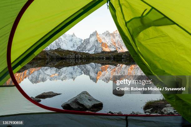 mont blanc massif view from tent at lake chesery, france - lake chesery stockfoto's en -beelden