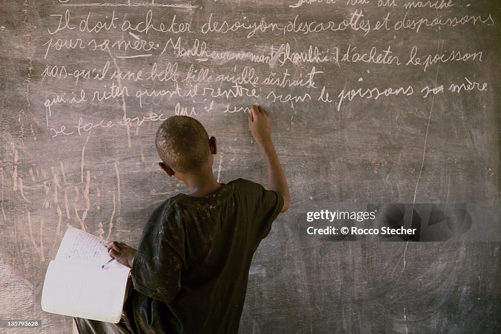 Child dictation at school in Burkina Faso Africa
