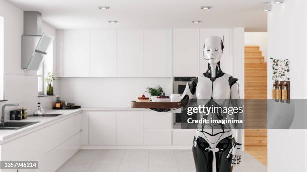 humanoid robot maid serving in kitchen - bionics stock pictures, royalty-free photos & images