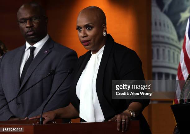 Rep. Ayanna Pressley speaks as Rep. Jamaal Bowman listens during a news conference at the U.S. Capitol December 8, 2021 in Washington, DC. House...