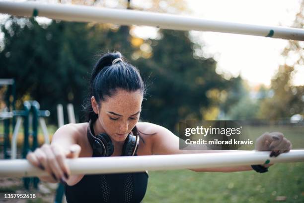 young woman exercising in nature - freckle stock pictures, royalty-free photos & images