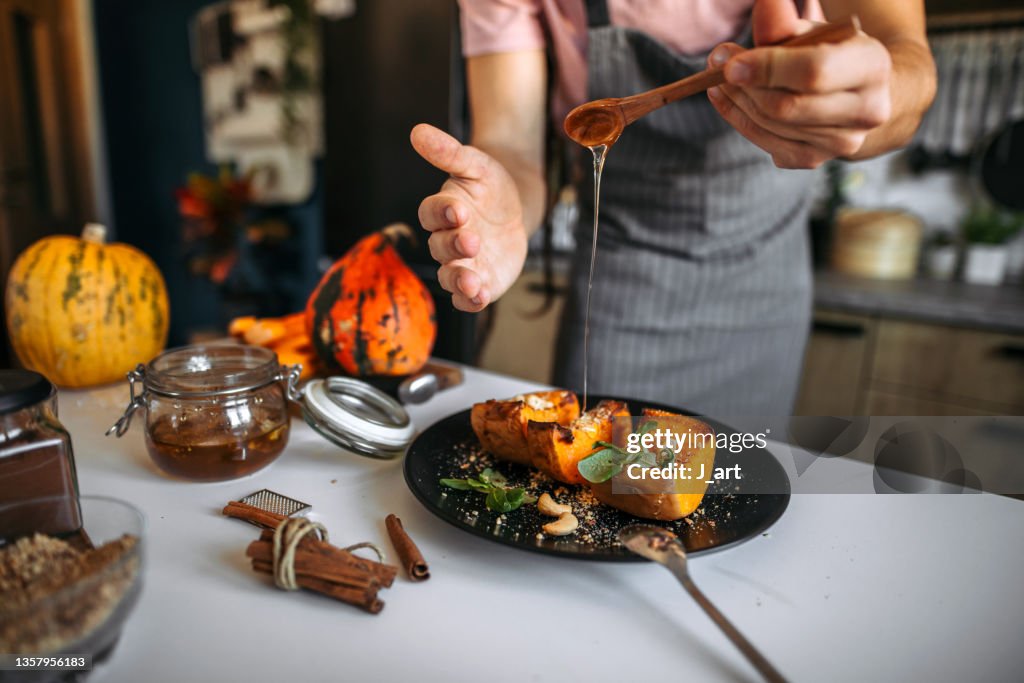 Baked pumpkin, Decorating holiday sweet on a plate.