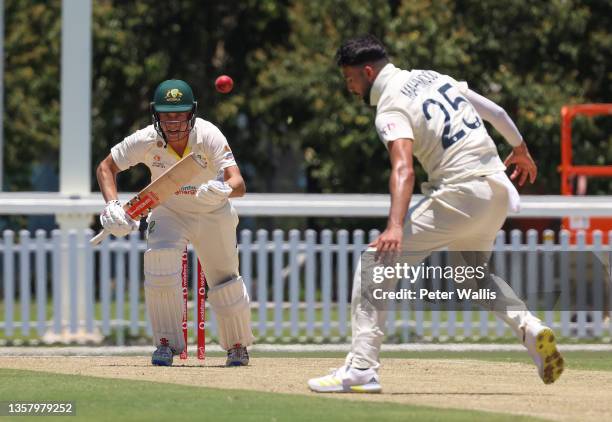 Australia A's Henry Hunt looks to run while England Lions stops the ball during the Tour Match between Australia A and England Lions at Ian Healy...