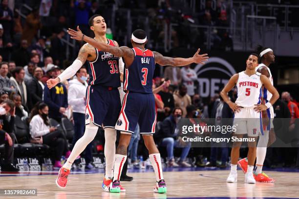 Kyle Kuzma of the Washington Wizards celebrates a three point basket with Bradley Beal to take the lead with .06 seconds left in overtime against the...