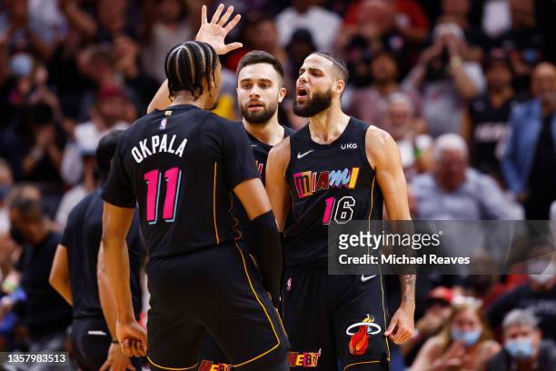 Caleb Martin of the Miami Heat celebrates a dunk against the Milwaukee Bucks during the second half at FTX Arena on December 08, 2021 in Miami,...