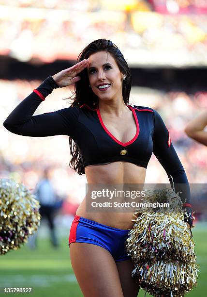 Member of the Washington Redskins Cheerleaders performs during the game against the New England Patriots at FedEx Field on December 11, 2011 in...