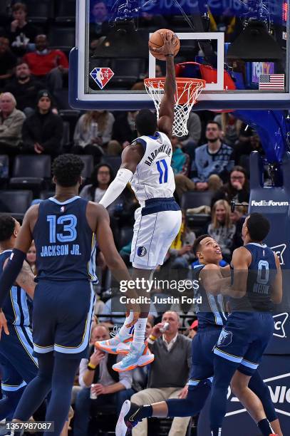 Tim Hardaway Jr. #11 of the Dallas Mavericks dunks against the Memphis Grizzlies during the second half at FedExForum on December 08, 2021 in...