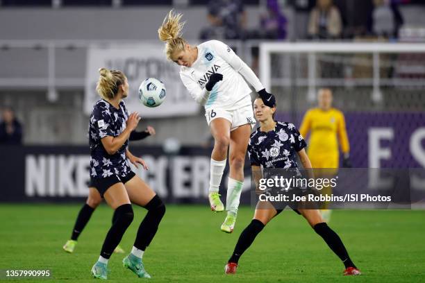 Allie Long of NJ/NY Gotham FC battles for the ball against Taylor Otto and Cece Kizer of Racing Louisville FC during a game between NJ/NY Gotham City...