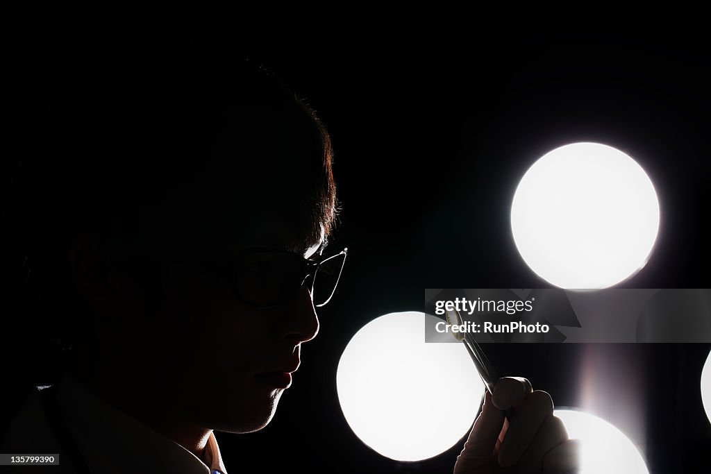 Doctor handling pills with forceps