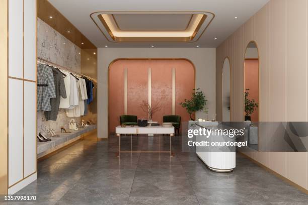 interior of luxury clothing store with clothes, shoes and other personal accessories - boutique shopping stock pictures, royalty-free photos & images