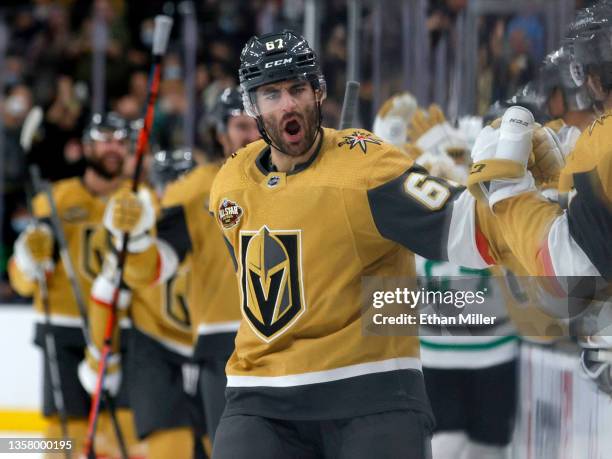 Max Pacioretty of the Vegas Golden Knights celebrates with teammates on the bench after scoring a third-period goal against the Dallas Stars during...