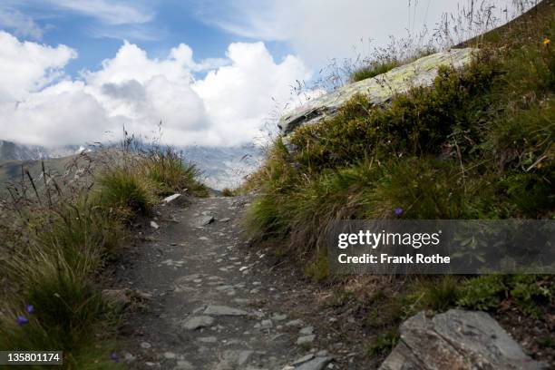 a hiking trail leads into the air and heaven - newoutdoors stock pictures, royalty-free photos & images