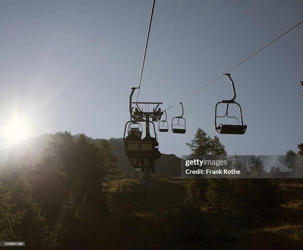 Chairlift leads up the hill in the mountains