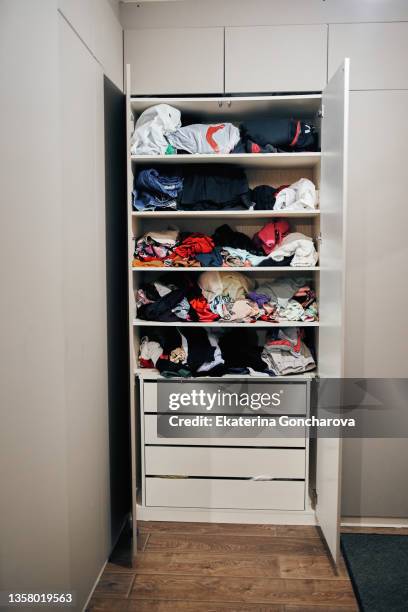 vertical wardrobe with colorful clothes. - storage basket stock pictures, royalty-free photos & images