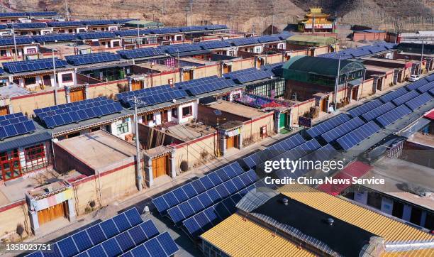 Aerial view of solar panels installed on the roof of residential houses at Jianzha County on December 8, 2021 in Huangnan Tibetan Autonomous...