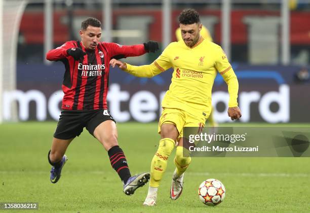 Alex Oxlade-Chamberlain of Liverpool is challenged by Ismael Bennacer of AC Milan during the UEFA Champions League group B match between AC Milan and...