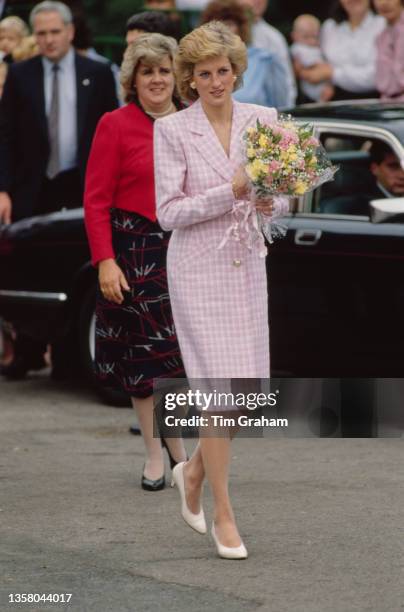 British Royal Diana, Princess of Wales , wearing a pink-and-white checked coatdress, during a visit to St Albans Cathedral in St Albans,...