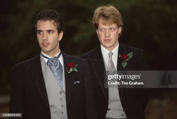 British businessman Darius Guppy, the Best Man, and the groom, British peer and journalist Charles Spencer, 9th Earl Spencer in the grounds of St...