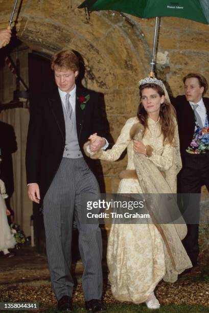 British peer and journalist Charles Spencer, 9th Earl Spencer and his bride, British fashion model Victoria Lockwood, wearing a wedding dress...