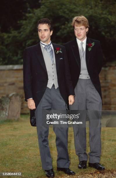 British businessman Darius Guppy, the Best Man, and the groom, British peer and journalist Charles Spencer, 9th Earl Spencer in the grounds of St...