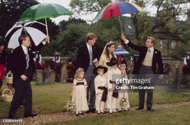 British peer and journalist Charles Spencer, 9th Earl Spencer and his bride, British fashion model Victoria Lockwood, wearing a wedding dress...