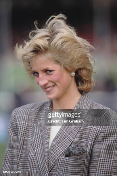 British Royal Diana, Princess of Wales wearing a Glen Plaid blazer, her hair blowing in the wind, attends Burghley Horse Trials at Burghley House...