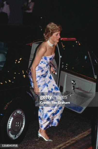 British Royal Diana, Princess of Wales , wearing a strapless pale pink-and-blue Catherine Walker evening gown, attends the Royal Premiere of 'When...