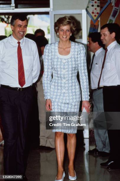 British Royal Diana, Princess of Wales , wearing a pale blue-and-white Catherine Walker suit with an enlarged dogstooth check pattern, during a visit...