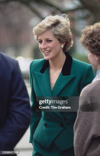 British Royal Diana, Princess of Wales , wearing a green suit with a black collar on the jacket, during a visit to the Thomas Coram Foundation...