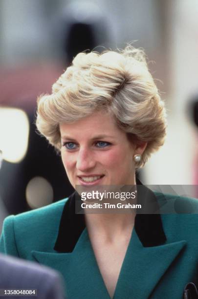 British Royal Diana, Princess of Wales , wearing a green suit with a black collar on the jacket, during a visit to the Thomas Coram Foundation...