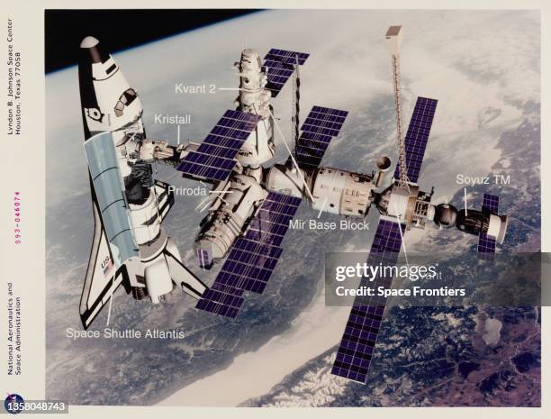 Technical rendition of the Space Shuttle Atlantis docked with the Kristall module of the Russian Space Station Mir, with the Lake Baikal region of...