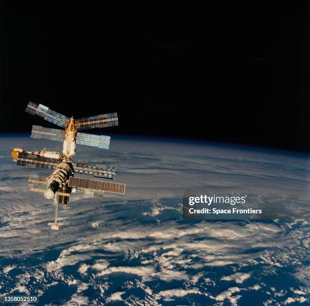 Russian Space Station Mir against a backdrop of the south Pacific Ocean and the Tasman Sea, as seen from Space Shuttle Atlantis mission STS-76, 22nd...
