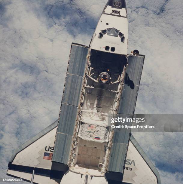 View of the Space Shuttle Atlantis, the Orbiter Docking System , the connective tunnel, and the Spacehab module can be seen in the payload bay, as...