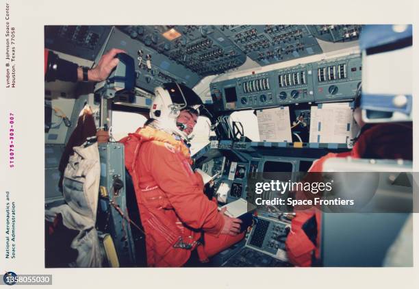 American NASA astronaut Andrew M Allen and American NASA astronaut Scott J Horowitz wearing their partial-pressure launch-and-entry suits at the...