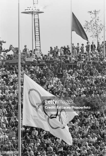 The Olympic flag flying at half mast inside the Olympiastadion during the memorial ceremony for the Israeli athletes and team members killed by the...