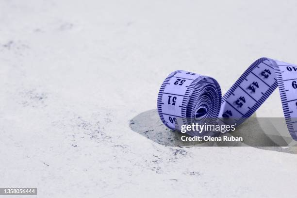 purple measuring tape on white background - metric system stock pictures, royalty-free photos & images