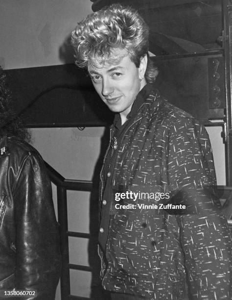 American singer, songwriter and guitarist Brian Setzer, his hair styled in a large quiff, circa 1985. Setzer is the frontman with American rockabilly...