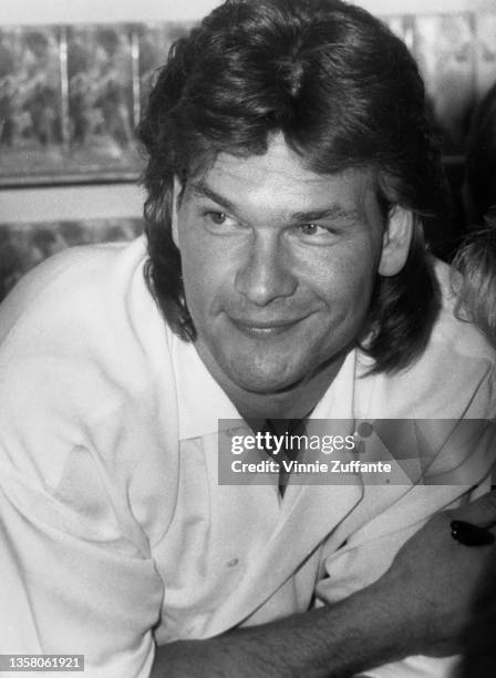 American actor, singer and dancer Patrick Swayze attends an in-store promotional event where he signed copies of the soundtrack to 'Dirty Dancing',...