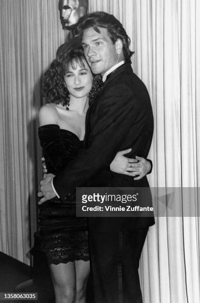 American actress Jennifer Grey and American actor, singer and dancer Patrick Swayze together in the press room of the 60th Academy Awards, held at...
