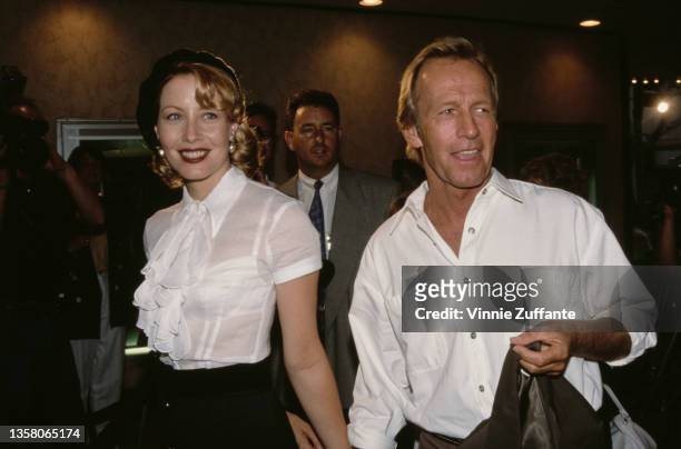 American actress Linda Kozlowski and her husband, Australian comedian and actor Paul Hogan attend the Westwood premiere of 'Unforgiven' held at the...