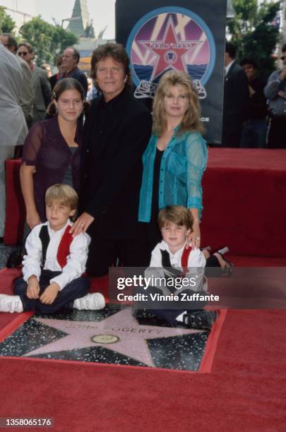 American singer, songwriter and musician John Fogerty, his wife Julie, their twin sons, Shane and Tyler, and Julie's daughter Lyndsay attend...