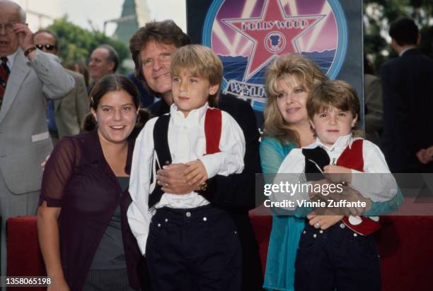 American singer, songwriter and musician John Fogerty, his wife Julie, their twin sons, Shane and Tyler, and Julie's daughter Lyndsay attend...