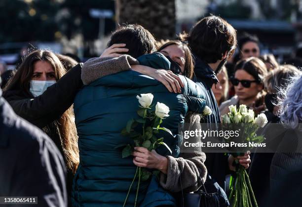 Two people embrace in a concentration and minute of silence in memory of Cristina, a woman victim of gender violence, in the Plaza del Ayuntamiento,...