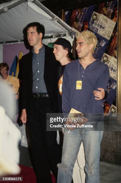American musician Krist Novoselic, American musician Dave Grohl and American guitarist Pat Smear attend the 1994 MTV Video Music Awards, held at...